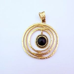 Gold tone hammered style pendant with black stone